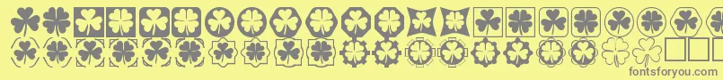 Cloverthings-fontti – harmaat kirjasimet keltaisella taustalla