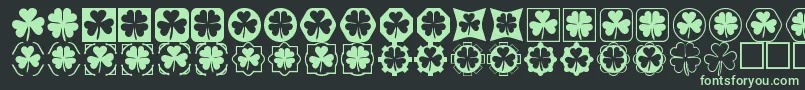 Cloverthings Font – Green Fonts on Black Background