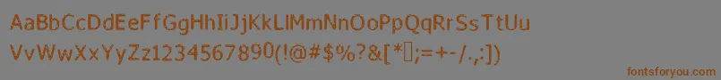 フォントFada – 茶色の文字が灰色の背景にあります。