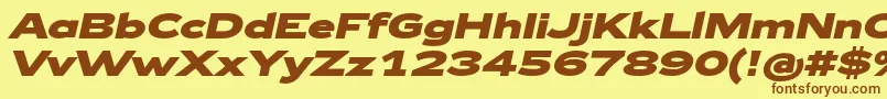 フォントZeppelin43BoldItalic – 茶色の文字が黄色の背景にあります。