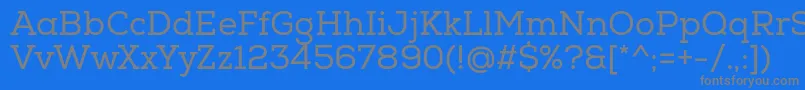 フォントNexaSlabRegular – 青い背景に灰色の文字