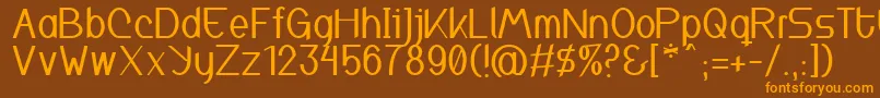 フォントInspyratta – オレンジ色の文字が茶色の背景にあります。