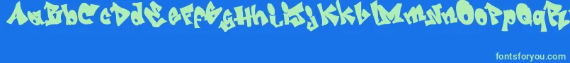 GrafitiJedagraphicx-Schriftart – Grüne Schriften auf blauem Hintergrund