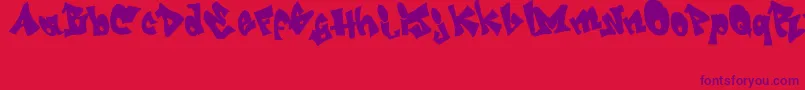 GrafitiJedagraphicx Font – Purple Fonts on Red Background