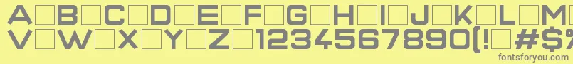 SuperQuickFormula-fontti – harmaat kirjasimet keltaisella taustalla