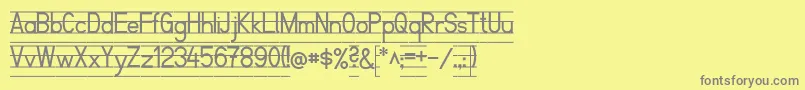 SchulfibelNordLinie2-Schriftart – Graue Schriften auf gelbem Hintergrund