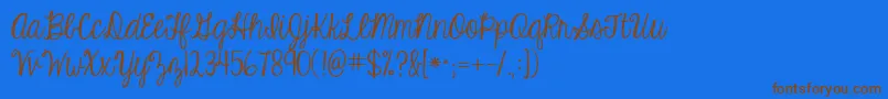 Kgeyeswideopenフォントについての詳細 フォントKgeyeswideopen – 茶色の文字が青い背景にあります。