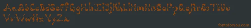 Шрифт Dollop4.9 – коричневые шрифты на чёрном фоне