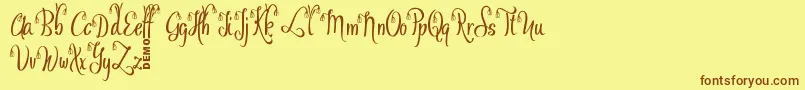 フォントOfalyDemo – 茶色の文字が黄色の背景にあります。
