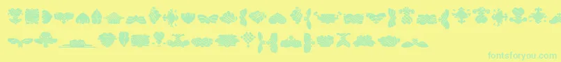 BlackOrnamentsFree-Schriftart – Grüne Schriften auf gelbem Hintergrund