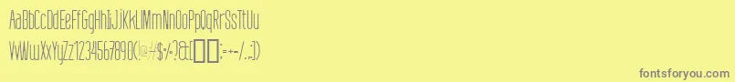 Czcionka DefattedMilkLight – szare czcionki na żółtym tle