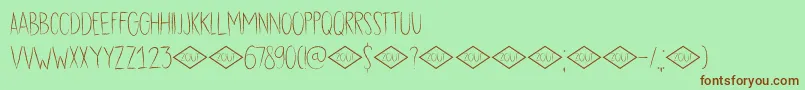 DkDubbelZout-Schriftart – Braune Schriften auf grünem Hintergrund
