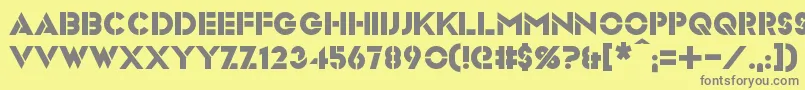 フォントVideopac – 黄色の背景に灰色の文字