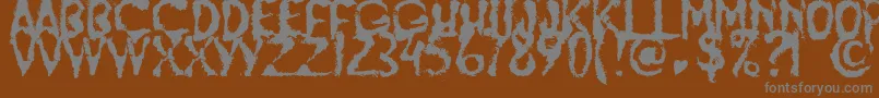 フォントJumpBurnIp2012 – 茶色の背景に灰色の文字