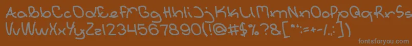 フォントExtraordinary – 茶色の背景に灰色の文字