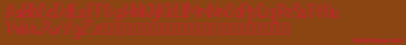 Loverlyregulardemo-Schriftart – Rote Schriften auf braunem Hintergrund
