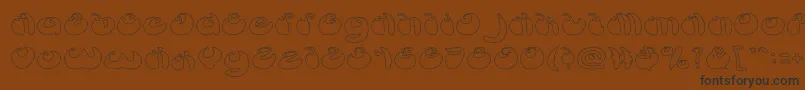 ButterflyHollow-fontti – mustat fontit ruskealla taustalla