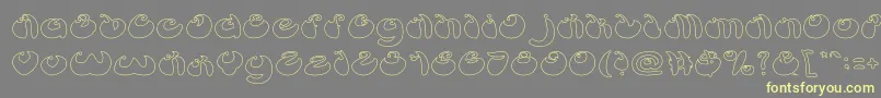 ButterflyHollow-Schriftart – Gelbe Schriften auf grauem Hintergrund