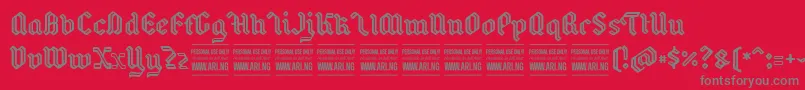 BackyardPersonal-fontti – harmaat kirjasimet punaisella taustalla