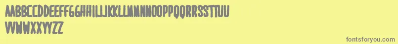 MaridavidExtrabold-fontti – harmaat kirjasimet keltaisella taustalla