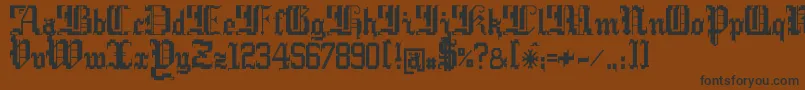 フォントArgorCwarScaqh – 黒い文字が茶色の背景にあります