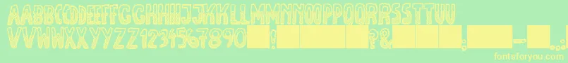 JmhEscamasBlackDown Font – Yellow Fonts on Green Background