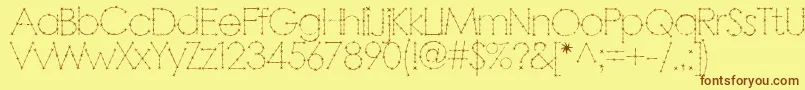 フォントBarbar – 茶色の文字が黄色の背景にあります。