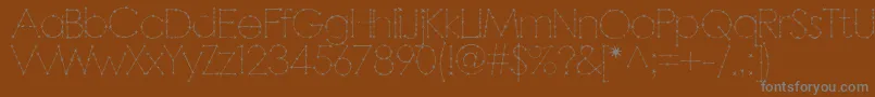 Barbar-fontti – harmaat kirjasimet ruskealla taustalla