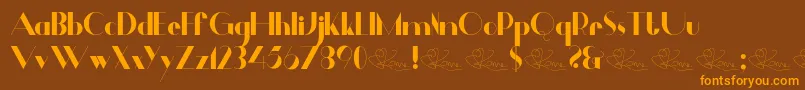 Czcionka Dalmais – pomarańczowe czcionki na brązowym tle