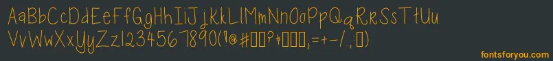 フォントKaraKaboodle – 黒い背景にオレンジの文字