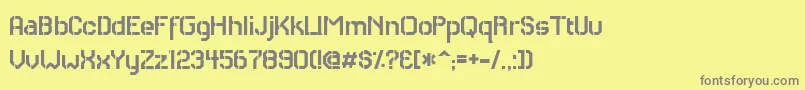 フォントRhCarrierStencil – 黄色の背景に灰色の文字