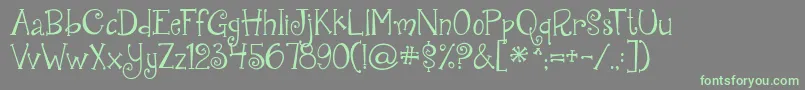Weitere Informationen zur Jandaquirkygirl-Schriftart Jandaquirkygirl-Schriftart – Grüne Schriften auf grauem Hintergrund