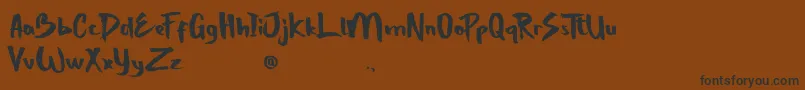 StrongBoldOne-Schriftart – Schwarze Schriften auf braunem Hintergrund