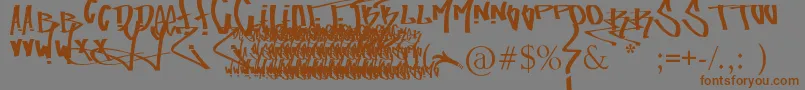 フォントFuckingTagFont – 茶色の文字が灰色の背景にあります。