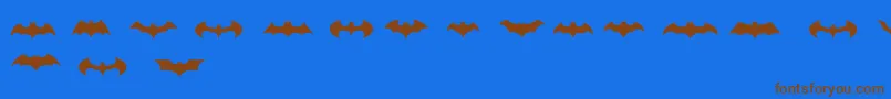 Шрифт BatmanLogoEvolutionTfb – коричневые шрифты на синем фоне