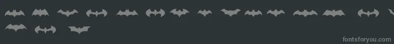 フォントBatmanLogoEvolutionTfb – 黒い背景に灰色の文字