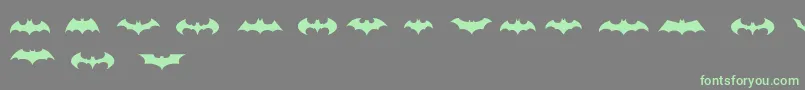 フォントBatmanLogoEvolutionTfb – 灰色の背景に緑のフォント