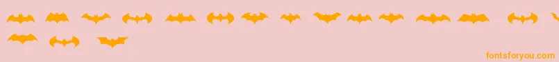 フォントBatmanLogoEvolutionTfb – オレンジの文字がピンクの背景にあります。