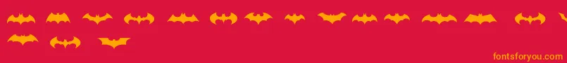 Шрифт BatmanLogoEvolutionTfb – оранжевые шрифты на красном фоне