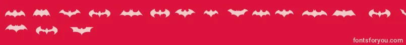 BatmanLogoEvolutionTfb-Schriftart – Rosa Schriften auf rotem Hintergrund