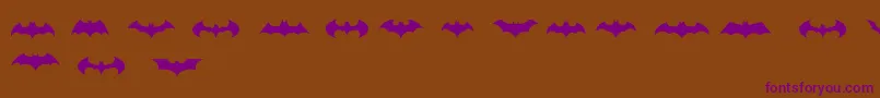 BatmanLogoEvolutionTfb Font – Purple Fonts on Brown Background