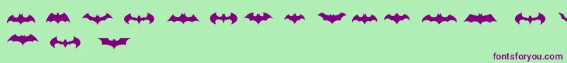 BatmanLogoEvolutionTfb-fontti – violetit fontit vihreällä taustalla