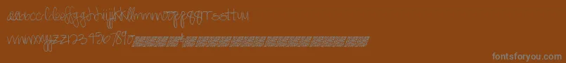 Czcionka Springdaisy – szare czcionki na brązowym tle