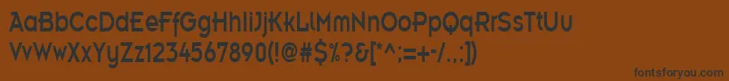 フォントEmblemcondensedRegular – 黒い文字が茶色の背景にあります