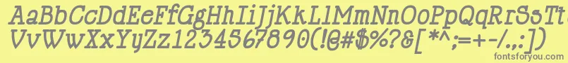 HappyPhantomBoldItalic-fontti – harmaat kirjasimet keltaisella taustalla