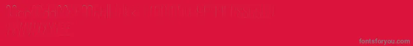 Wonderlust-fontti – harmaat kirjasimet punaisella taustalla