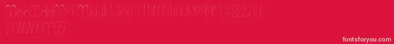 Wonderlust-fontti – vaaleanpunaiset fontit punaisella taustalla