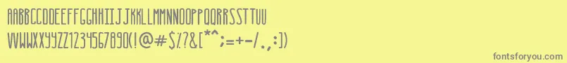 フォントExtupida – 黄色の背景に灰色の文字