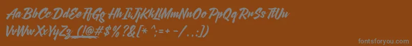 AgneyaDemoVersion-fontti – harmaat kirjasimet ruskealla taustalla