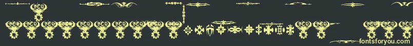 フォントMarquisDeSadeOrnaments – 黒い背景に黄色の文字